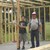 Tom and my grandson helping build storage barn.